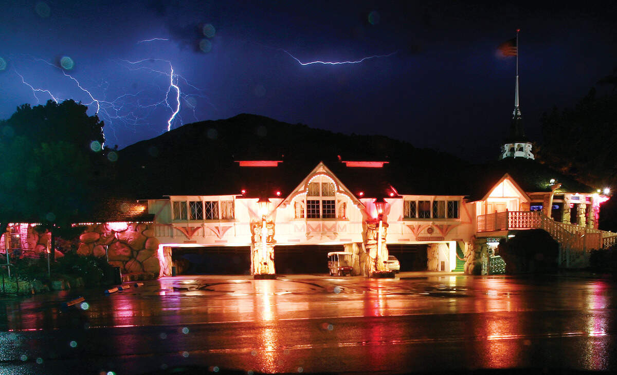A thunderstorm lights up the sky behind the Alex Madonna Expo Center in San Luis Obispo in 2007. The Salt + Soul Conference, scheduled for March 28 at the Expo Center, has been postponed until the fall.