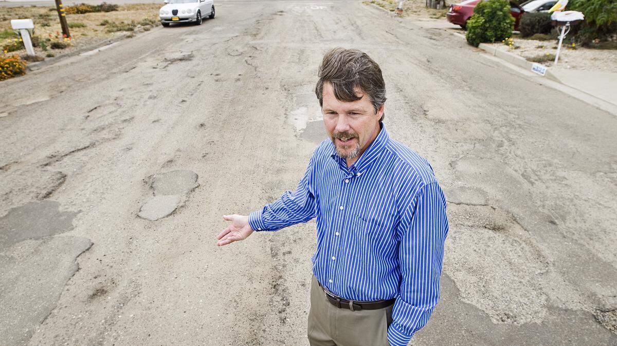 Grover Beach Public Works Director Greg Ray describes the condition of the road on Saratoga Avenue between North Ninth and North 10th streets.