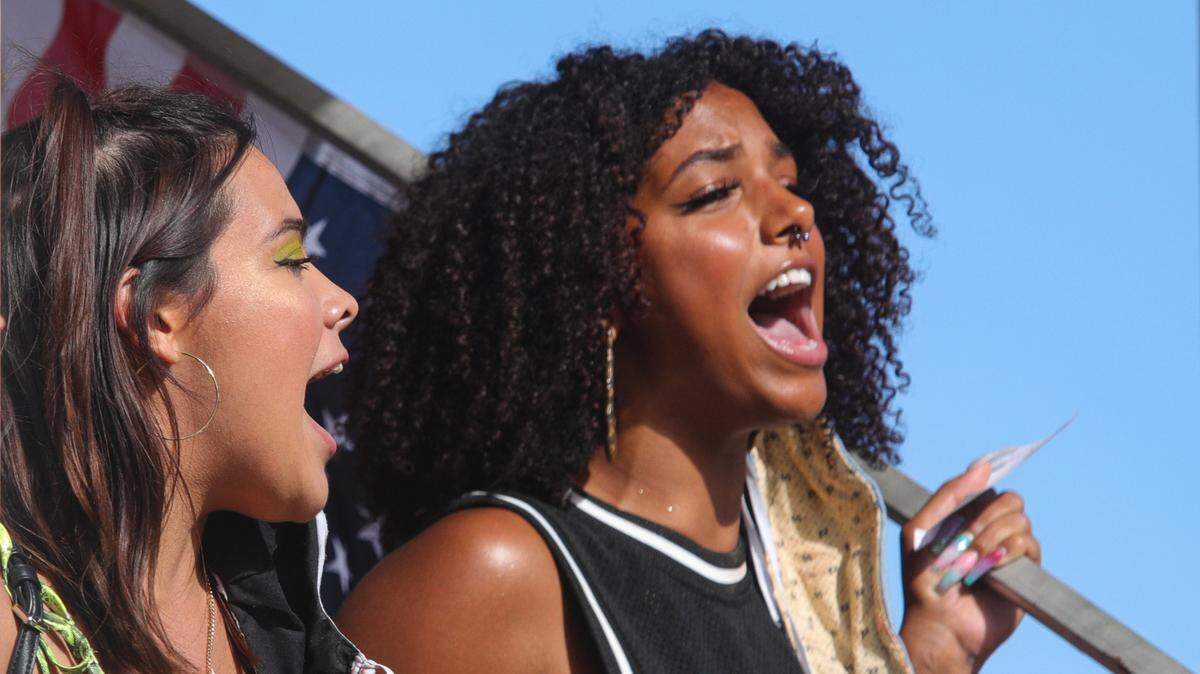 Melissa Elizalde, left and Tianna Arata lead a chant at Mitchell Park at a No Justice No Peace protest.