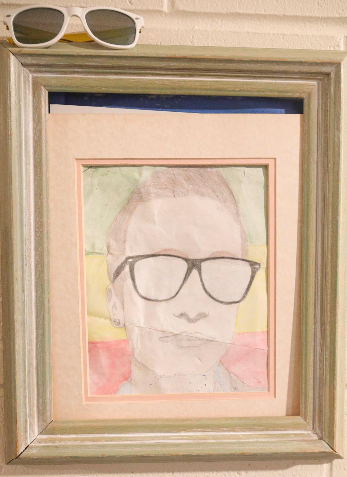 A self-portrait of Thomas Jodry, who died at the age of 21 in a fall from a San Luis Obispo parking structure on Sept. 14, 2019, hangs in his parents’ Atascadero home on Sept. 10, 2024.