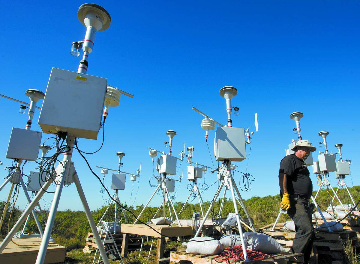 Brian Aunger, Air Pollution Control District engineer, walks among 19 air monitors being calibrated in 2012 as part of a continuing study of air quality downwind from the Oceano Dunes State Recreational Vehicle Area.
