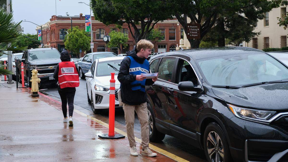 Robert Keeley collects a ballot at the San Luis Obispo County Government Center drive-thru ballot drop-off location in downtown San Luis Obispo on Nov. 8, 2022.