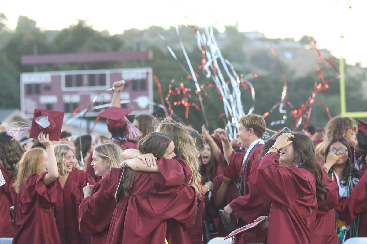 The crowd of Paso Robles High School graduates erupted into hugs, cheers and laughter after the cap toss during commencement on June 5, 2026. Around 414 students graduated.
