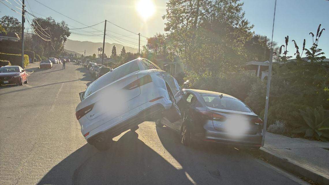 Driver reaching for sunglasses crashes onto top of parked car in SLO, police say