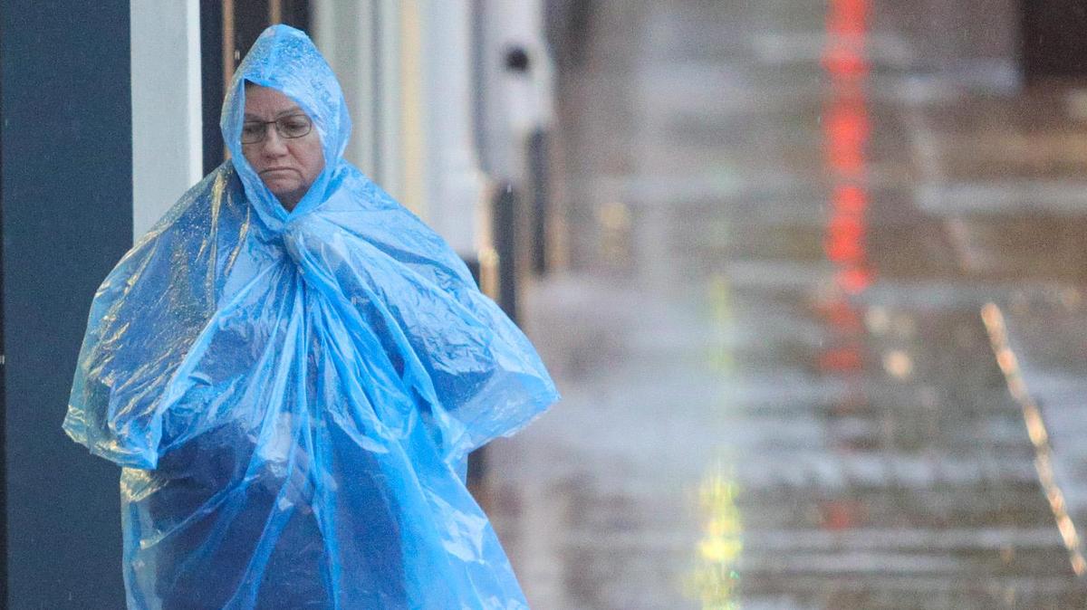 Jean St. James and Marshmallow wait for the light to change at Chorro Street as rain continued to fall in downtown San Luis Obispo on Tuesday, Dec. 14, 2021. After a winter storm drenched the region that month, January and February have been remarkably dry.