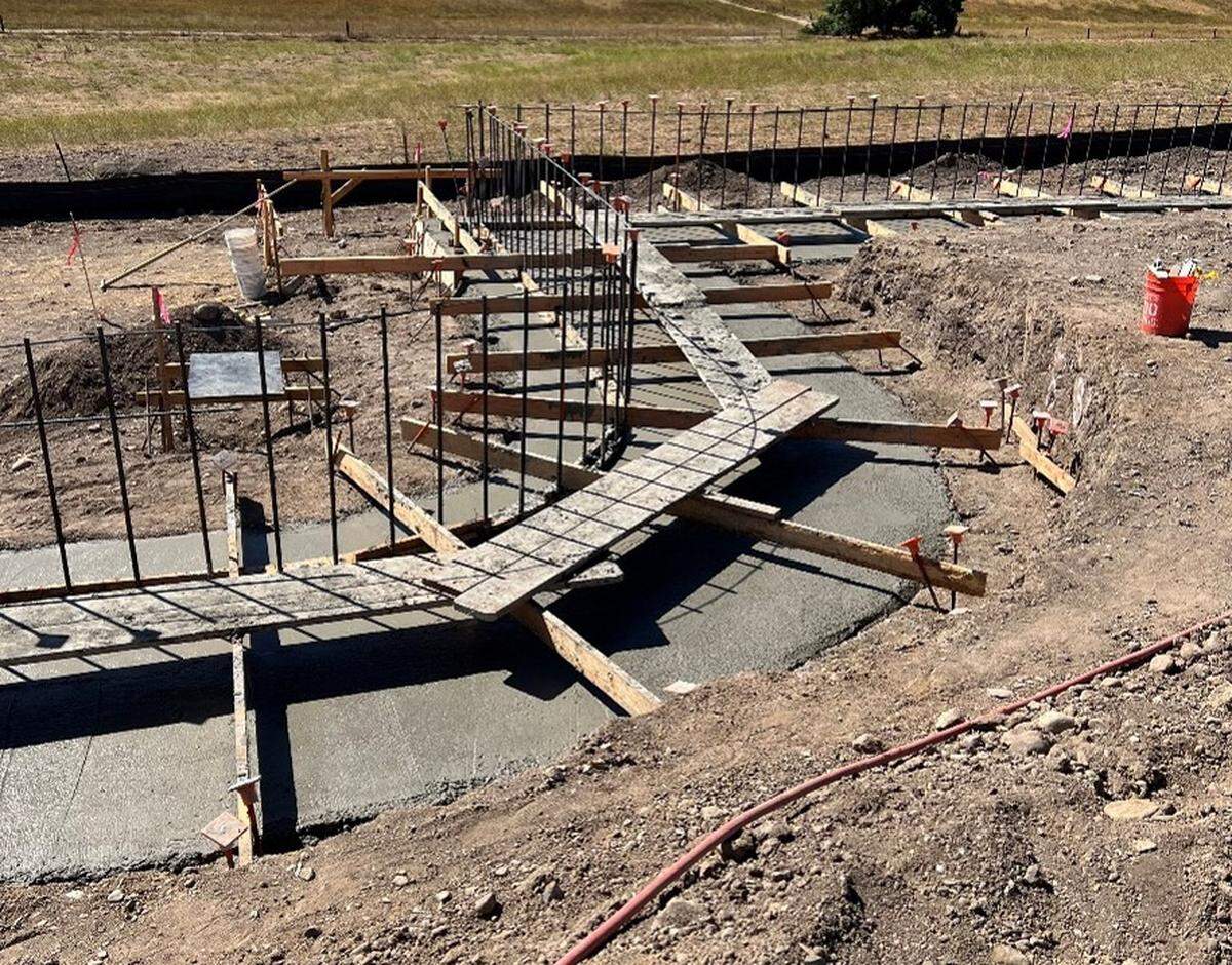 A retaining wall goes up at the Cal Fire and San Luis Obispo County Sheriff’s Office dispatch center in Templeton. Construction is scheduled to be completed in August 2025.