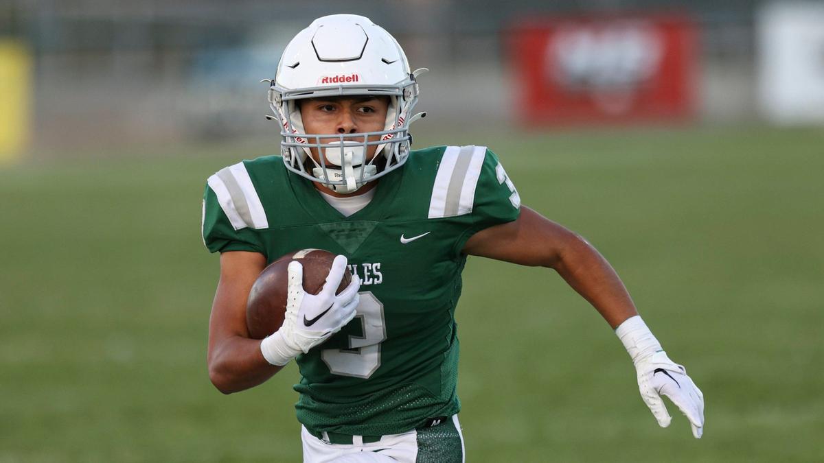 Armando Soto looks upfield on a run. Monache High School beat Templeton 20-17 in a football game on Aug. 30, 2024.