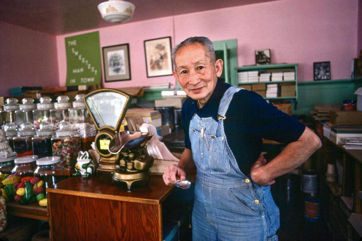 Richard Chong poses for a photo in his candy store at 798 Palm St. in 1977.