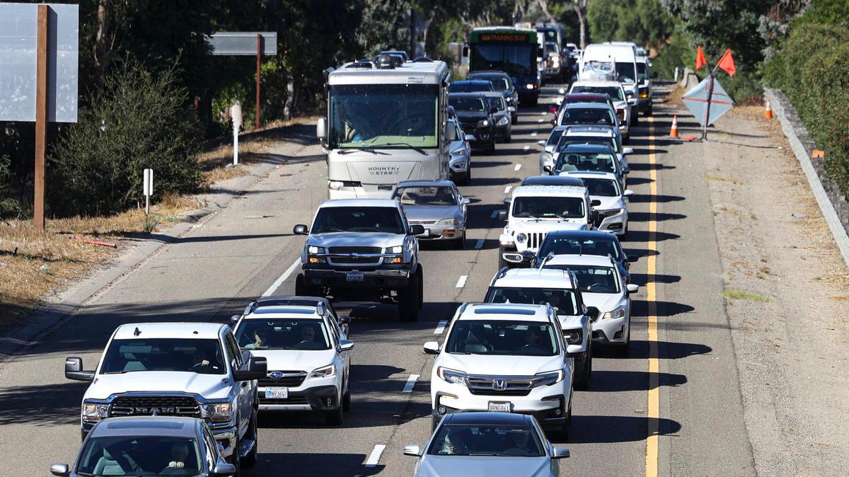Traffic backs up in San Luia Obispo Monday Oct 21, 2024. Caltrans workers were removing trash and weeds from the center divider on northbound US 101 north of San Luis Obispo. Traffic will be reduced to one lane during the day Oct 21 and 22.