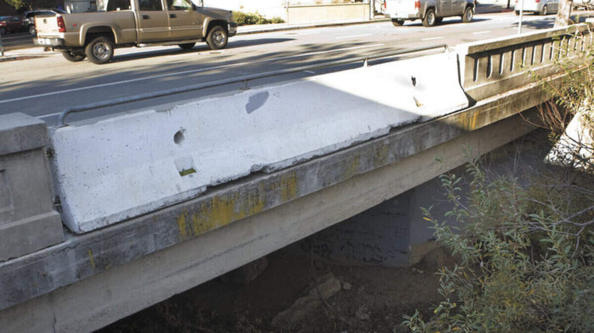 The bridge over San Luis Creek on Marsh Street is showing signs of age. One railing has been replaced with a temporary concrete section.