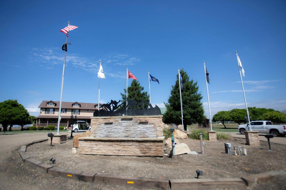 Flags representing the military services greet guests at Legacy Village, a residential treatment center for veterans in Nipomo.