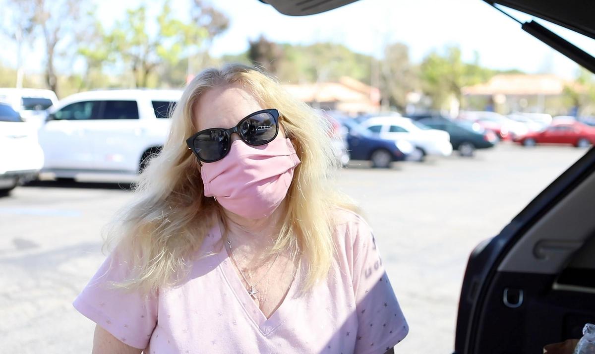 Dixie Camou of Paso Robles wears a cloth mask while shopping at Albertsons in Paso Robles.