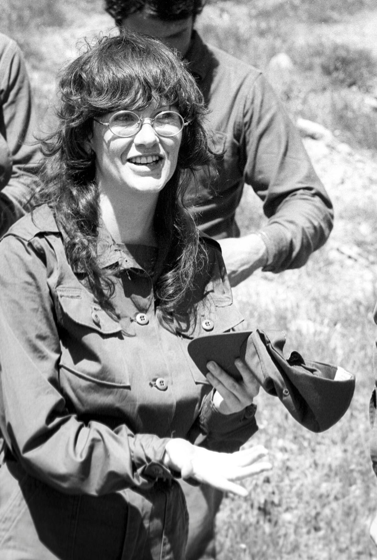 Toni Cortner, cap in hand was among the first women who joined Cal Poly ROTC cadets after the Army opened ranks to women. They train on April 6, 1974. (The first time this image was published it was mirrored, this is the correct orientation.)