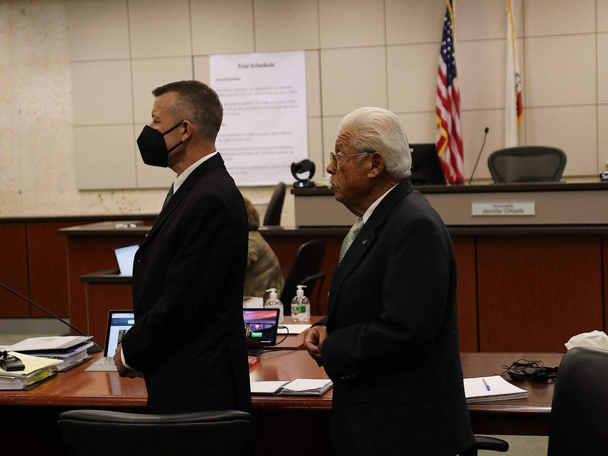 Paul Flores (left) and his father, Ruben Flores, stand in Monterey County Superior Court in Salinas on Sept 26, 2022. The two are on trial in connection with the 1996 murder of Kristin Smart.