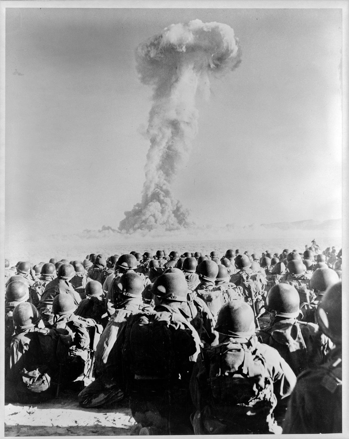 ATOMIC FRONT LINE…Troops of the 11th airborne division turn to watch the atomic cloud rise from the desert floor at Frenchman’s Flat, Nev. The first ground forces in the “front line” of a nuclear explosion, they had been hunched low, with their backs to the blast, at the detonation. Published Nov. 3, 1951 in the Telegram-Tribune.