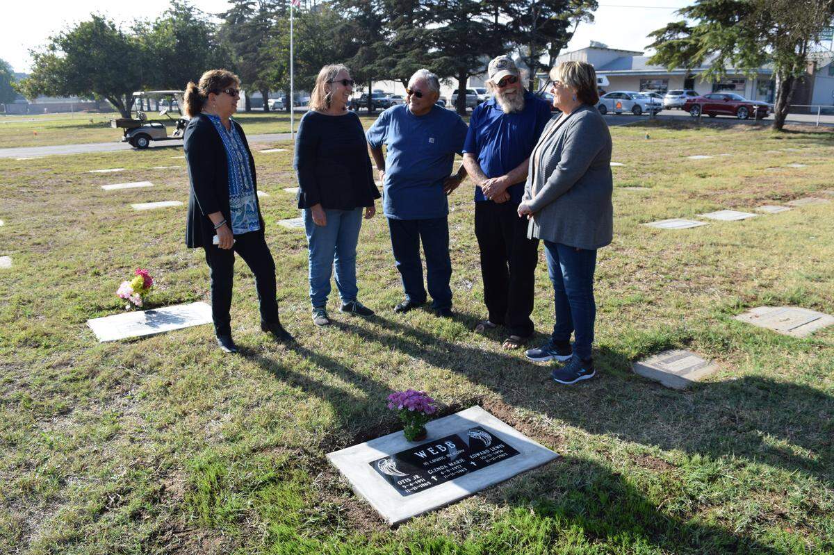From left, Mona Olivas Tucker, Beverly Sylvester Huddleston, Steven Armandico and Linda Austin donated to provide a gravestone for their former classmates, Otis, Glenda and Edward Webb, who died in 1963.