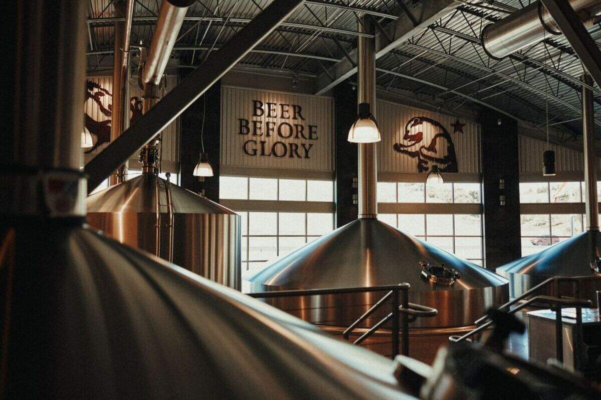 A sign in a Firestone Walker Brewing Company brewing area reminds people of the company’s philosophy, “Beer before glory.”