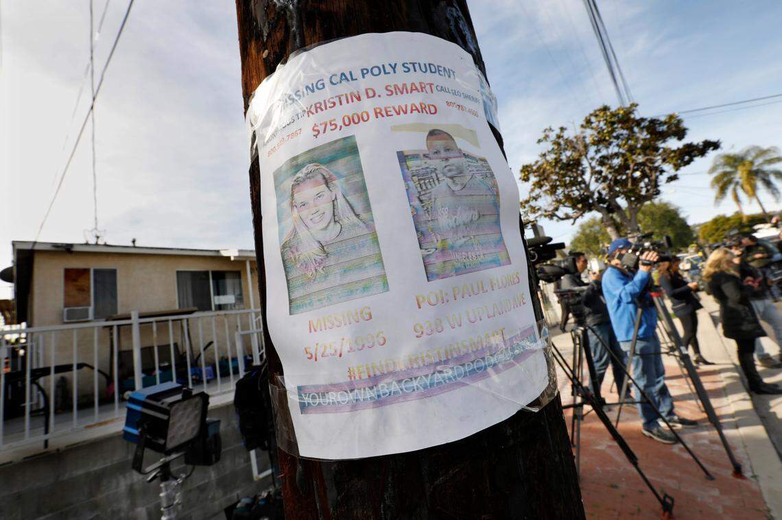 A faded missing person flyer for Kristin Smart was posted on a telephone pole on Feb. 5, 2020, across the street from the home of Paul Flores in San Pedro, California. Sheriff’s deputies search Flores’ home in the case of the missing student, who vanished from Cal Poly San Luis Obispo in 1996.