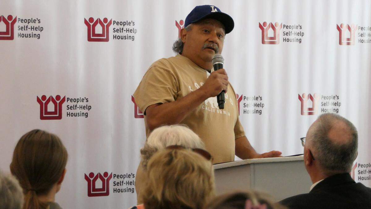 Retired U.S. Marine Corps veteran Ronald Medina, who got a spot at Templeton Place II after three years of homelessness, speaks to a crowd of guests at the grand opening of the complex on Monday, July 17, 2023. Templeton Place II consists of 36 units that serve seniors and veterans, with 10 units permanently set aside for formerly homeless veterans.