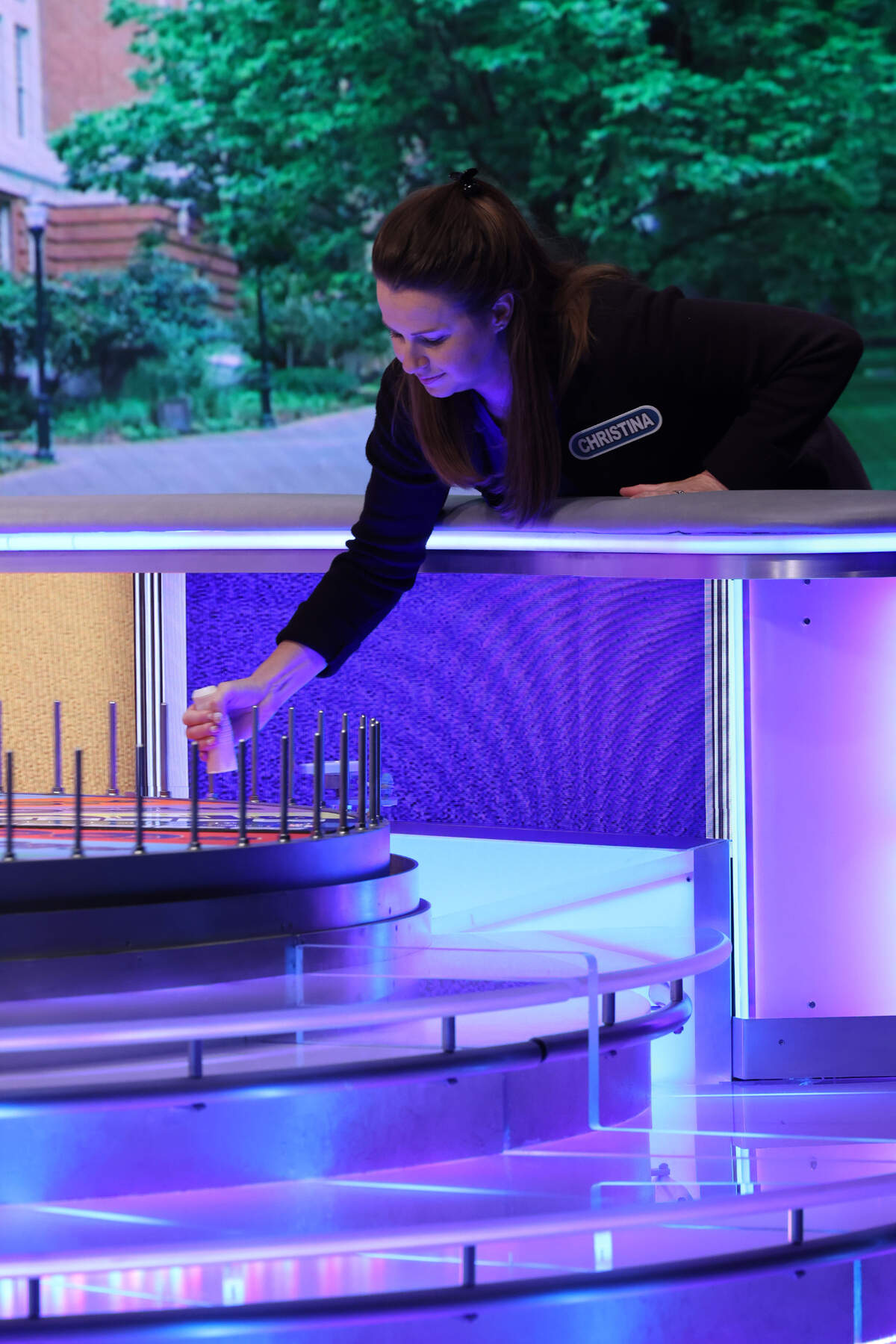 A “Wheel of Fortune” contestant uses a so-called “spinning cap” to turn the wheel.
