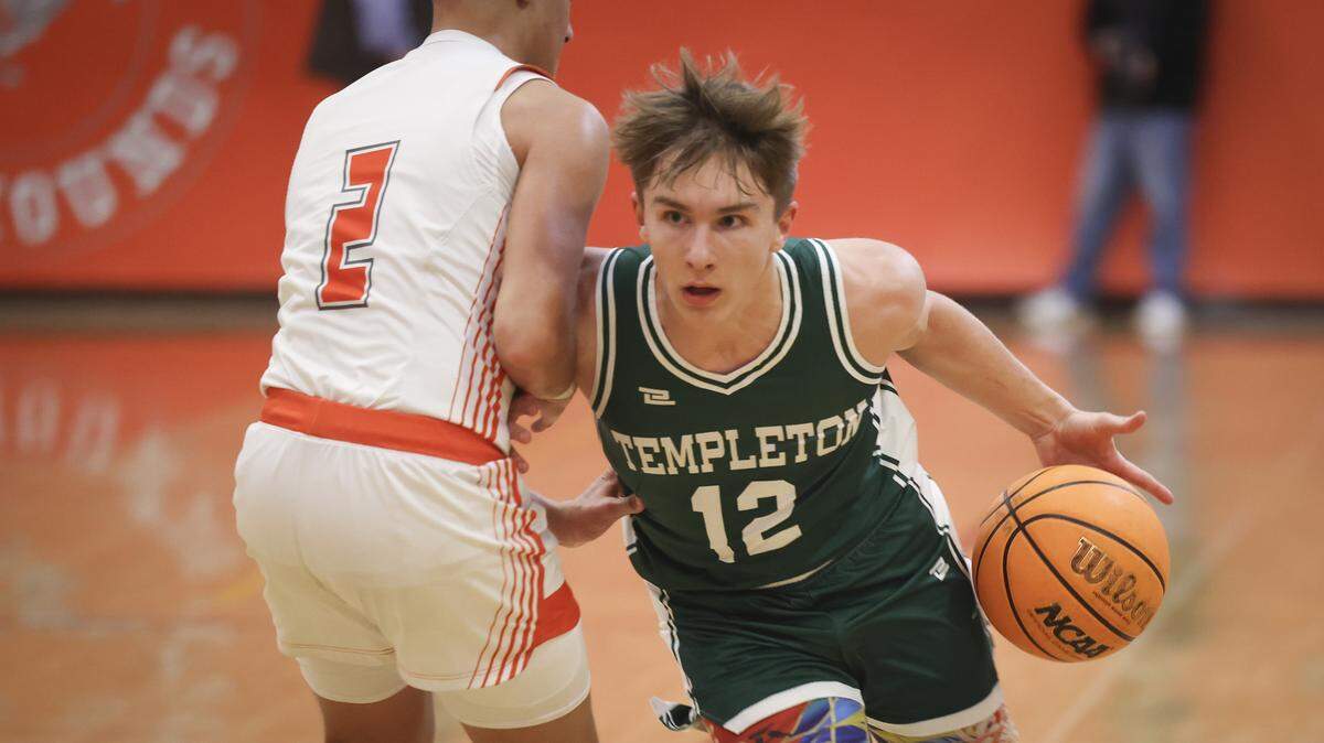 Kevin Sass drives around Isaiah Rodriguez. Atascadero beat Templetpon High School 76-55 in a basketball game on Jan. 20, 2026.