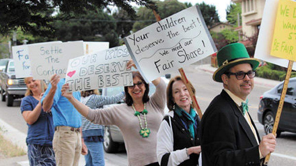 Teachers from Ocean View Elementary School in Arroyo Grande hold signs calling for a new contract agreement with the Lucia Mar school district during a rally in March 2015.