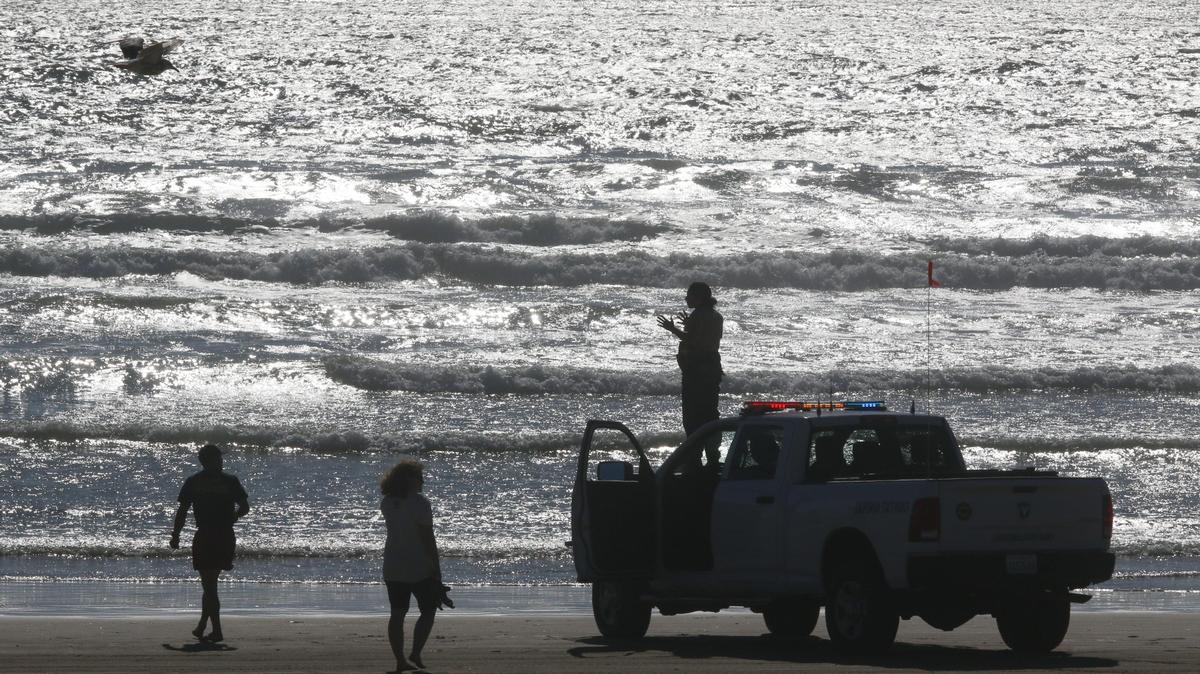 California parks rangers and lifeguards patrol Oceano Dunes State Vehicle Recreation Area. A proposed California law aims to make it easier for rangers and game wardens to receive compensation benefits for skin cancer.