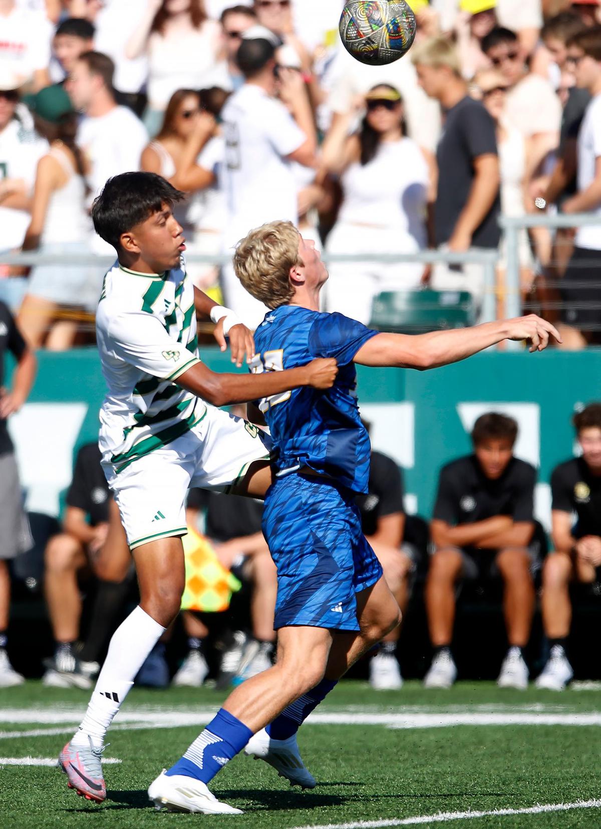 Cal Poly’s Nico Baltazar attempts to head the ball with UC Santa Barbara’s Zac Siebenlist. Cal Poly beat UCSB 2-0 in the annual Blue-Green Rivalry soccer game on Sept. 28, 2024.