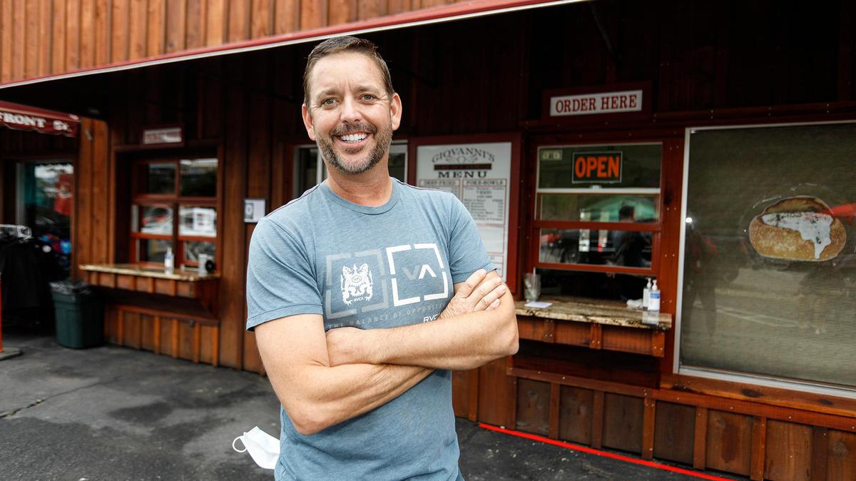 Giovanni DeGarimore poses for a picture in front of Giovanni’s Take-Out Express, located in the former home of The Coffee Pot restaurant in Morro Bay. On Feb. 5, 2024, DeGarimore has pleaded not guilty to six felony charges, including possession of child pornography.
