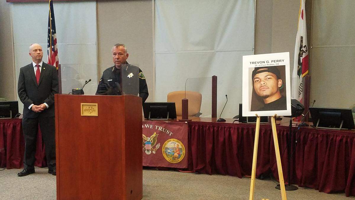 Paso Robles Police Chief Ty Lewis speaks at a news conference Friday announcing that human remains believed to be Trevon Perry were found at a home in Riverside. Listening at left is District Attorney Dan Dow.