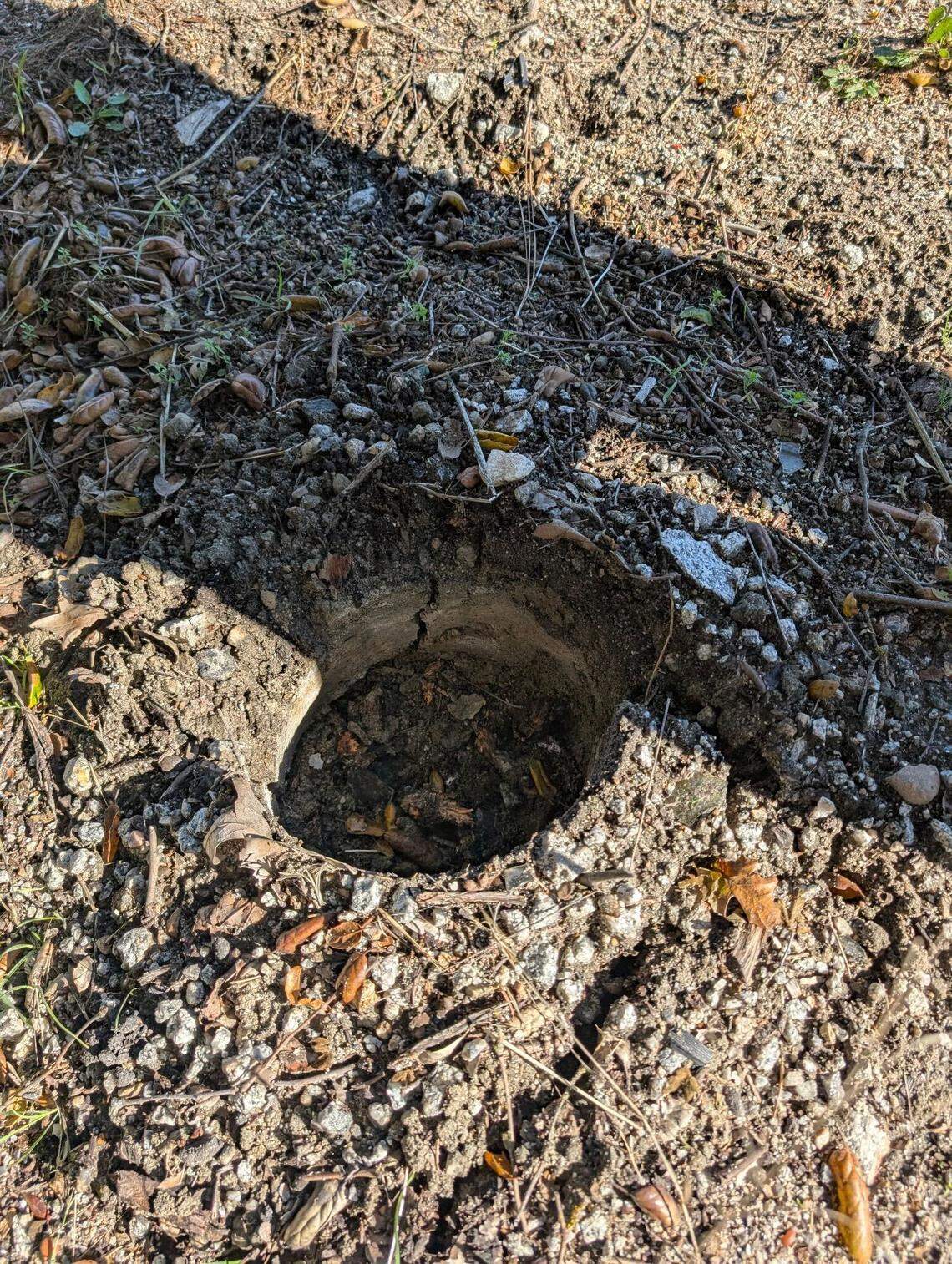 An empty hole shows where Todd Pinion’s memorial once stood on Nov. 22, 2025. The memorial was removed sometime between Nov. 17 and Nov. 22, according to Kristi Myrick.