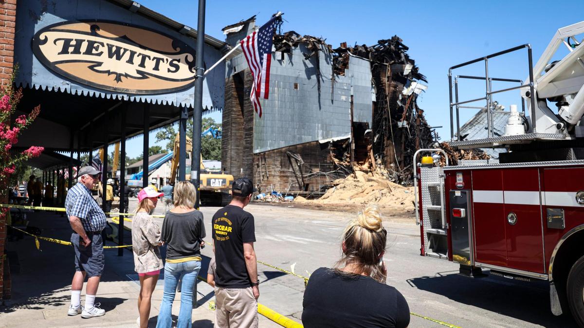 A steady stream of observers watched the demolition of the landmark Templeton Feed & Grain building on July 7, 2025. The historic building burned in a fire that sparked in the late night hours of July 4.