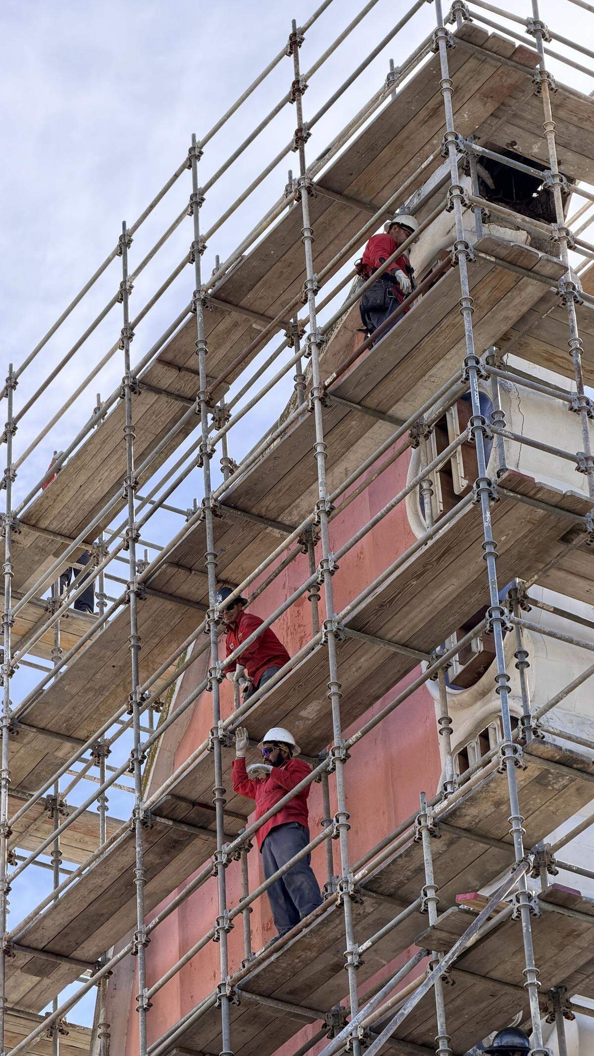 Workers set up scaffolding around the damaged Fremont Theater sign on Wednesday Feb. 25, 2026, in downtown San Luis Obispo.