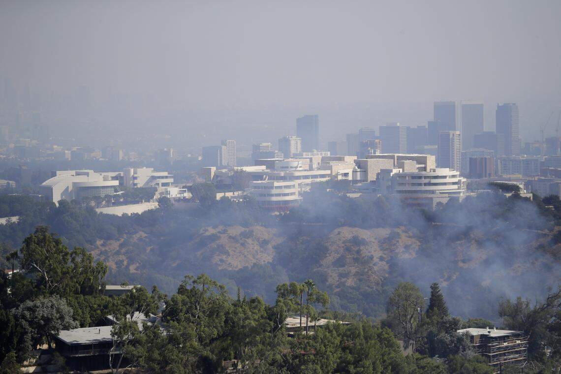 The Getty Center is covered in smoke as the Getty fire burns Monday, Oct. 28, 2019, in Los Angeles. (AP Photo/Marcio Jose Sanchez)