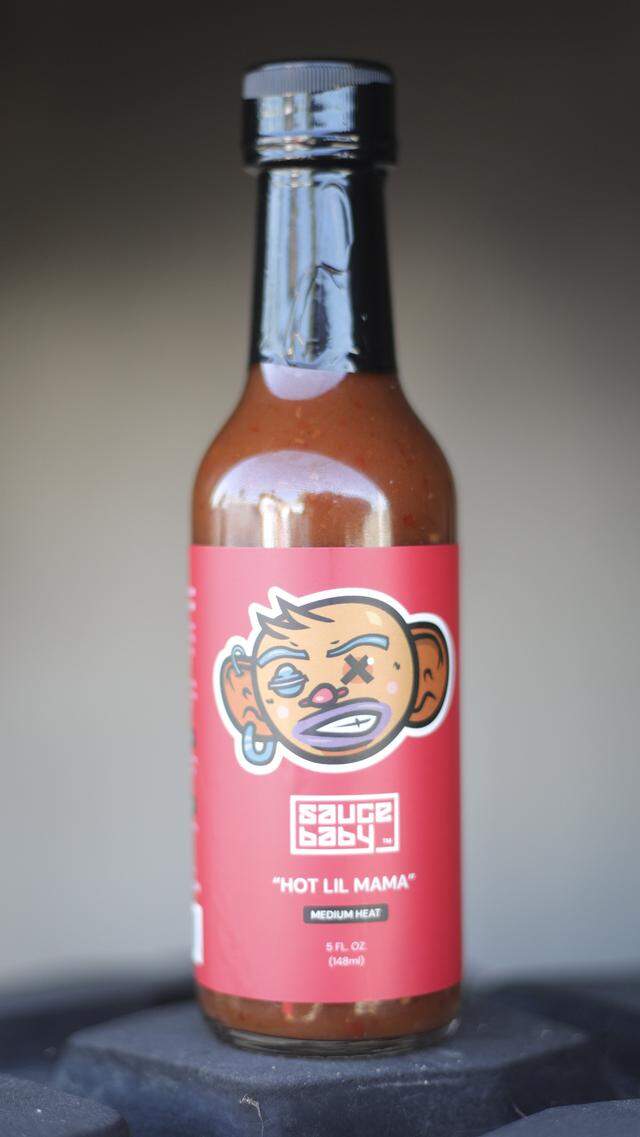 Diana and Michael Muranaka are owners of Sauce Baby. The Hot Lil Mam recipe includes a variety of chili peppers blended with hibiscus tea and tomatillo for a unique flavor, on Nov. 10, 2025.