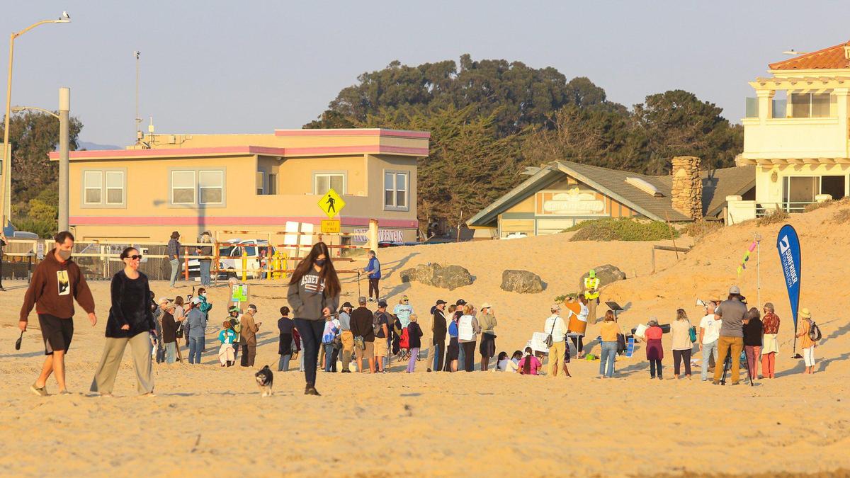 A group opposed to the reopening of the Oceano Dunes to vehicles gathered Thursday evening for speeches near the Pier Avenue entrance while others walked on the beach. The Oceano Dunes SRVA has been closed to vehicles since late March due to the coronavirus pandemic and to protect nesting birds on the beach.