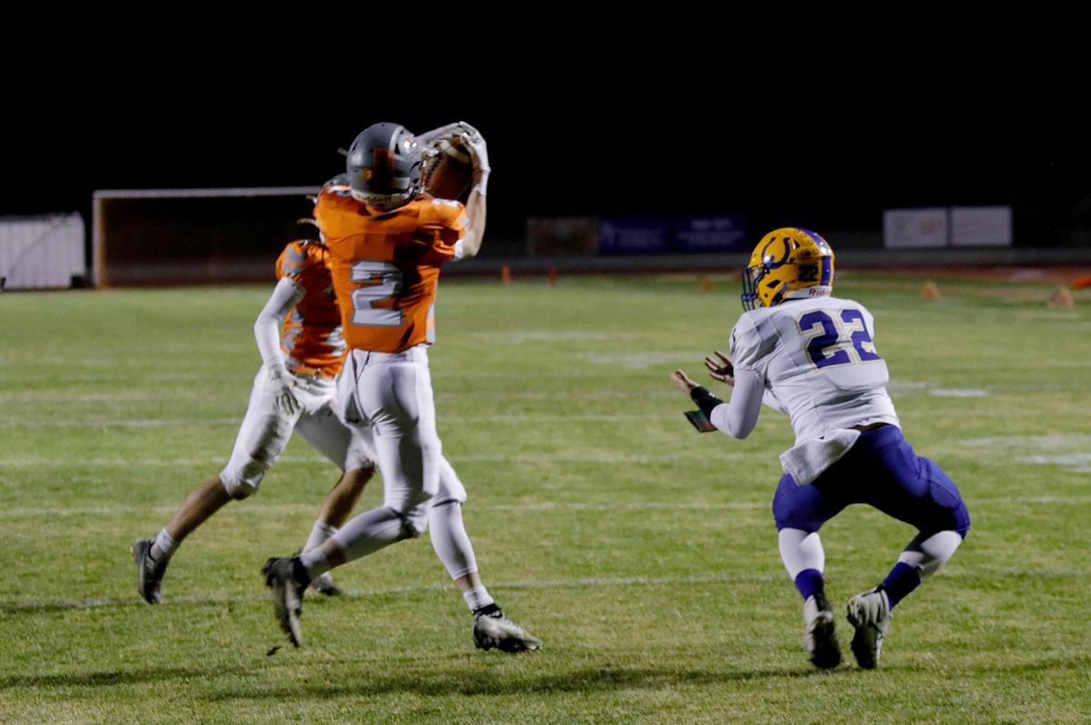 Greyhound Jarom Damery (2) intercepts a pass from Broncos wide-receiver Aaron Jones (22). Atascadero High School Greyhounds beat Dos Palos Broncos 35-0 in the prep football semifinals, Friday, Nov. 18, 2022.