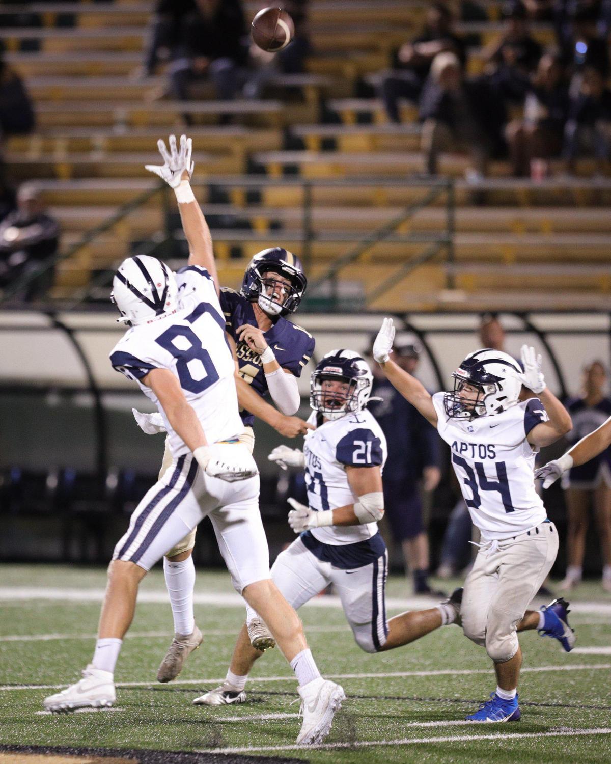 Quarterback Thomas Glenn throws under pressure from the Aptos defense in MIssion Prep’s 18-15 win at home at Cal Poly’s Spanos Stadium on Sept. 8, 2023.