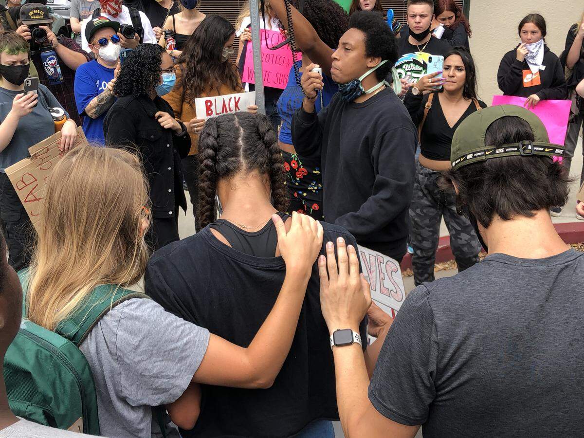 The march would periodically stop and give a moment for people to speak as it wound its way through downtown San Luis Obispo.