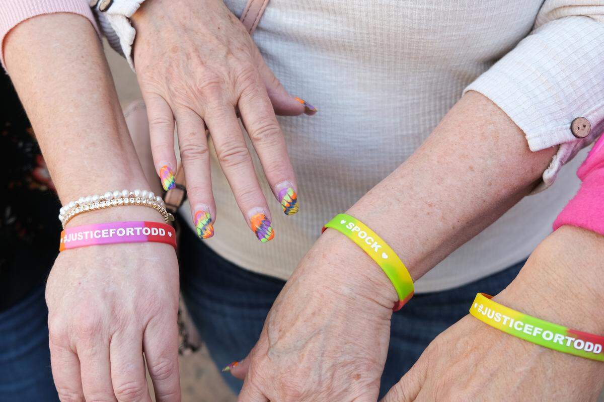 From left to right, Kristi Myrick, Melody Pinion and Jennifer Del Rio show their “#JusticeforTodd” bracelets outside San Luis Obispo Superior Court on Dec. 18, 2024. Pinion’s manicure was inspired by her son, Todd Pinion, who was murdered in an alleged hate crime on Oct. 23, 2024. The San Luis Obispo County District Attorney’s Office charged 21-year-old Tyler Stevens with murder and animal cruelty.