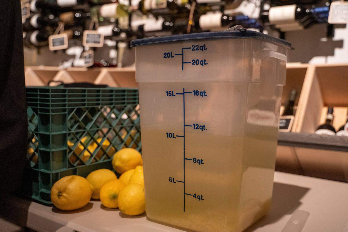 Fresh lemons and distilled vodka used in the making of limoncello sit in the wine storage at Giuseppe's Italian American Club on Tuesday, May 19, 2026. The deli and restaurant expansion of the existing Giuseppe's Cucina Italiana in Pismo Beach recently started its own offshoot brand of limoncello.