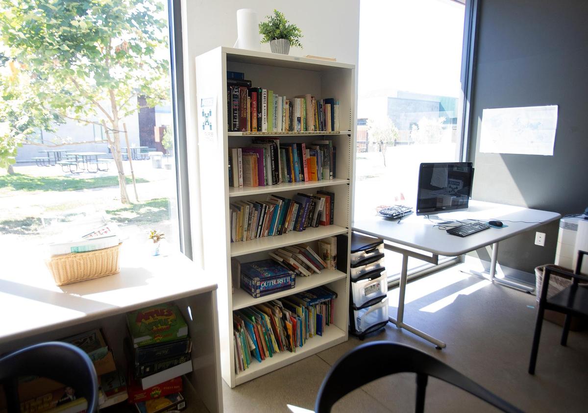 After five years of operating as an overnight shelter that features services during the day, 40 Prado Homeless Services Center will adopt a transitional housing model for its clients that will feature an increased focus on connection to services, with stays limited to 90 days. Clients can visit a small library and a playroom for children.