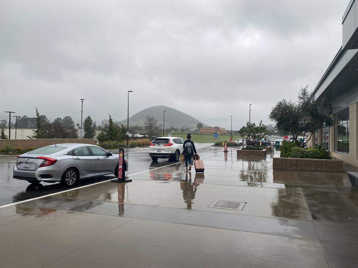 Travelers were soaked by rain at the San Luis Obispo County Airport on Monday, Jan. 9, 2023.