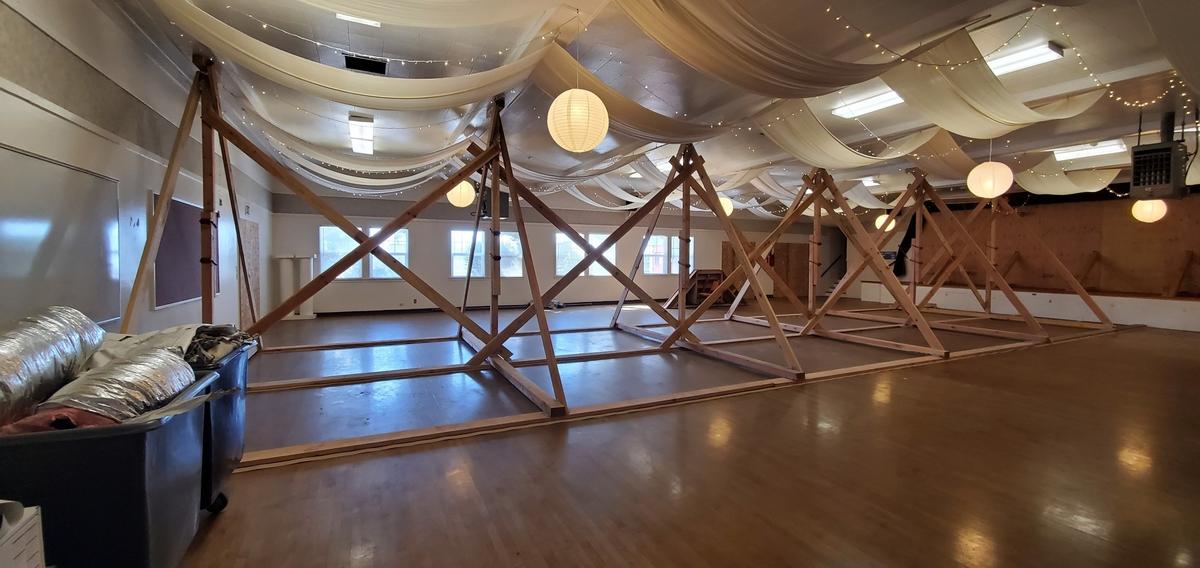 This photo of the interior of the Cayucos Vets Hall shows ceiling decor that has been in place since the building was red-tagged and declared inaccessible May 4, 2016, when a sagging stage floor alerted Cayucos Lions Club members to a structural problem. The county braced and stabilized the community hall, and the club had been renting out stable sections of it until a recent expansion of the closure. Now the historic building’s future is in the hands of the state fire marshal and those seeking funds to repair the former warehouse.