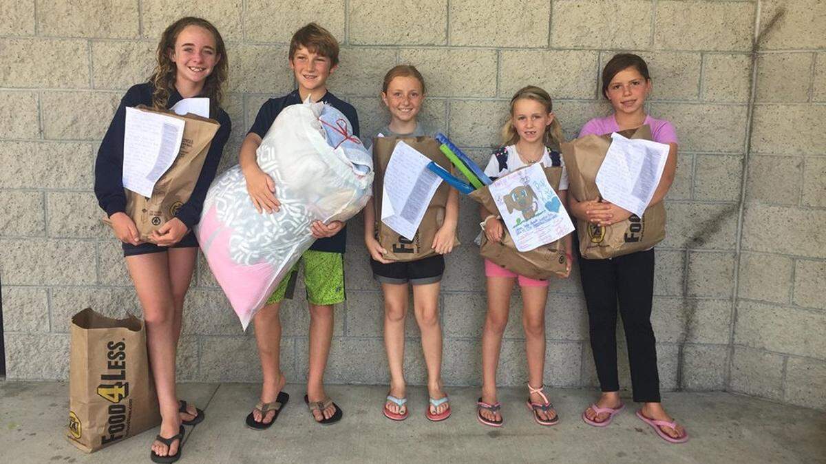 Seven children-Sofia Rice, Jake Harvey, Bixby Hardy, Olivia Rice and Kate Harvey (Amelia and Nora Pfost not pictured)- gathered together donations for San Luis Obispo County nonprofit RISE to help people and pets in need.