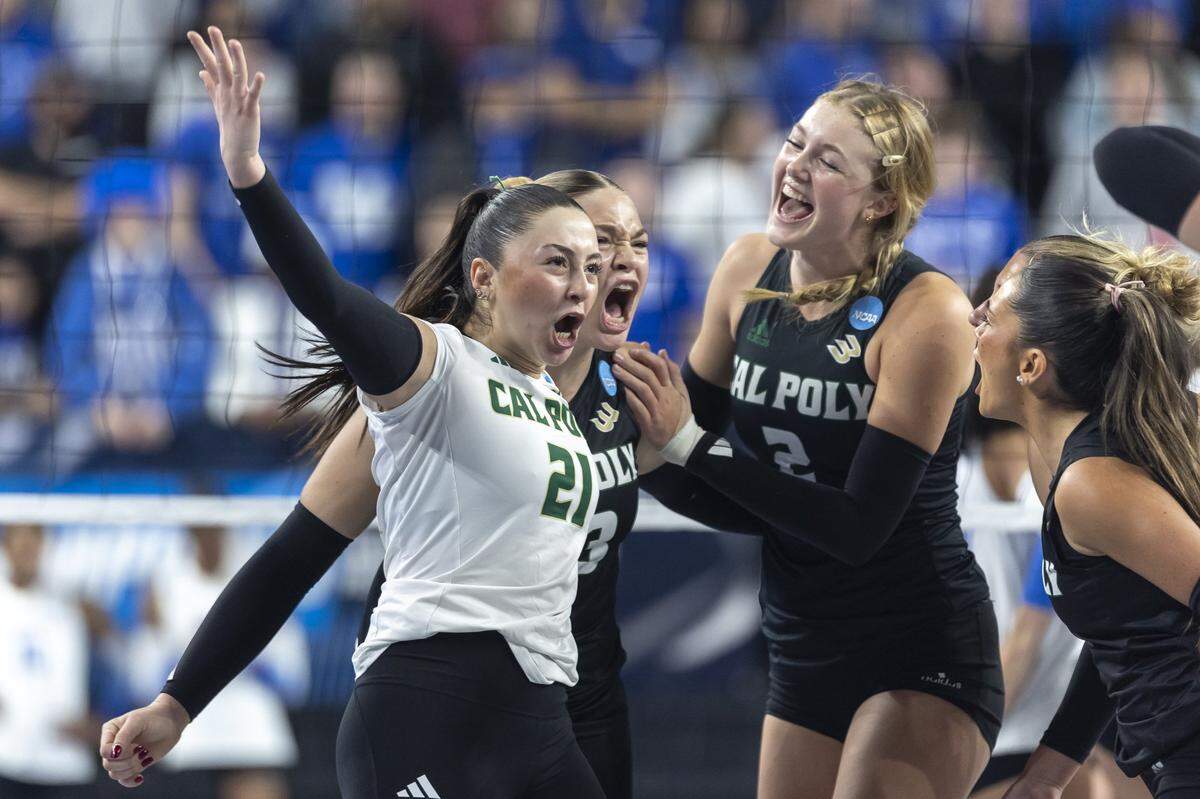 Cal Poly Mustangs libero/defensive specialist Elif Hurriyet (21) celebrates with her teammates after scoring a point in a game against Kentucky during the 2025 NCAA Volleyball Tournament Sweet 16 Lexington Regional at Historic Memorial Coliseum in Lexington, Ky., on Thursday, Dec. 11, 2025. Cal Poly’s season ended in a 3-0 sweep.