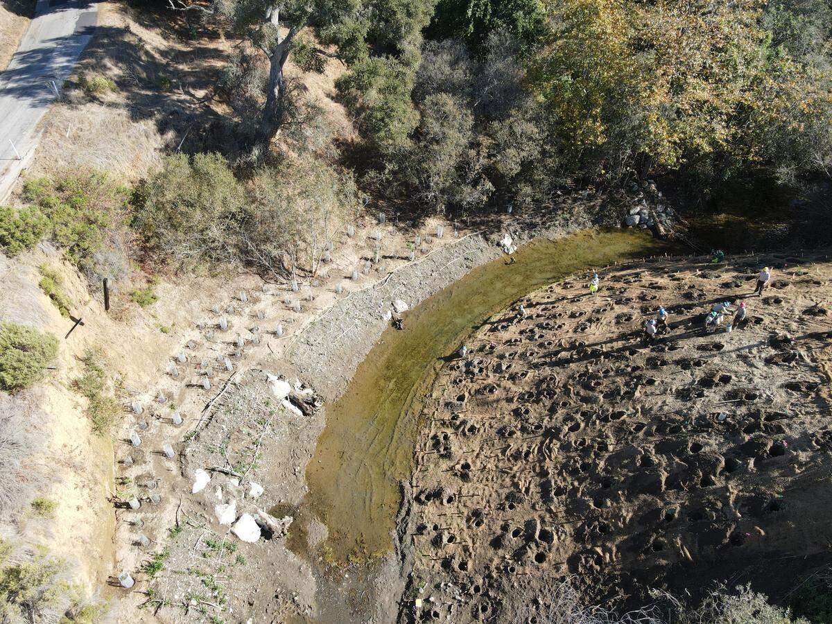 A drone photo shows the area where efforts were to be made in late 2020 to stabilize a stretch of the bank of Cambria’s Santa Rosa Creek. A late January storm carved away much of what the project had installed along the creek. Now the focus is on finding money to repair what was destroyed.