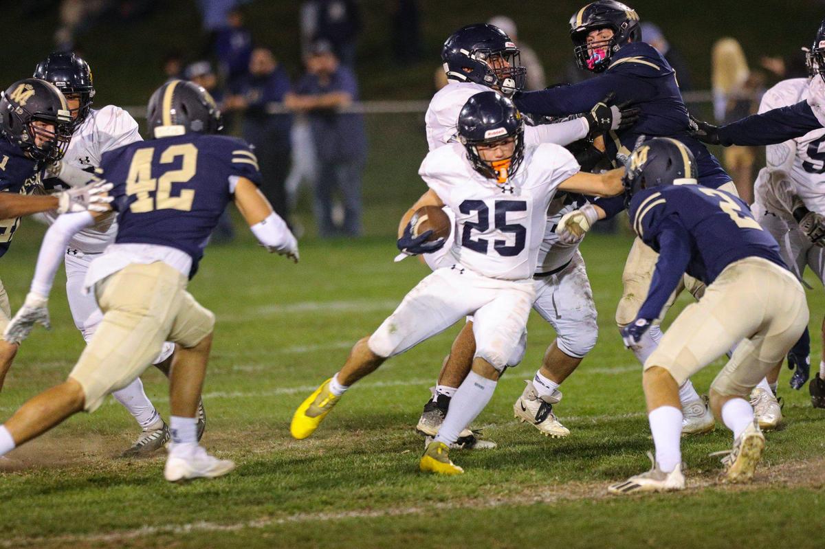 Junior Herlihy runs up the middle. Mission Prep beat Arroyo Grande 41-35 in a Mountain League football game on Oct. 14, 2022.
