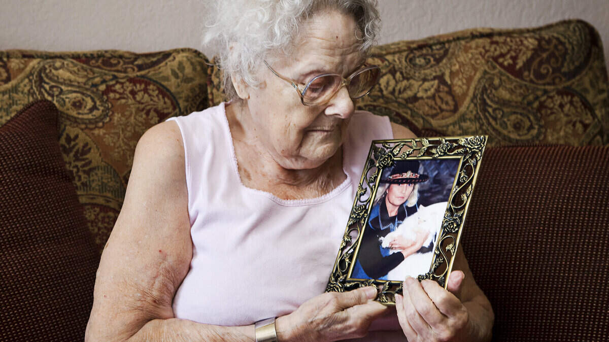 Paso Robles resident Brooke Mayo, 89, holds a 1993 photo of her daughter, Patricia, whom she gave up for adoption in 1942. After more than seven decades, mother and daughter were reunited this summer.