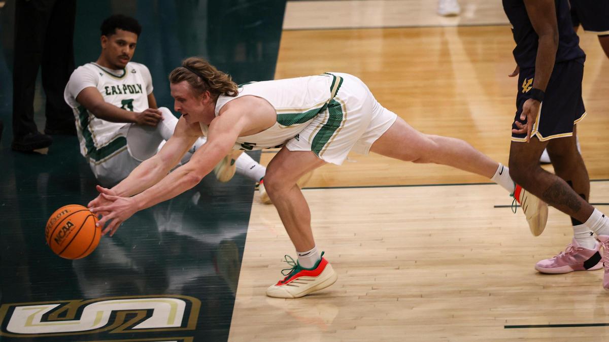Mac Rinker dives for a ball that fell out of bounds. Cal Poly lost to UCSD 81-67 in a basketball game on Feb. 20, 2025.